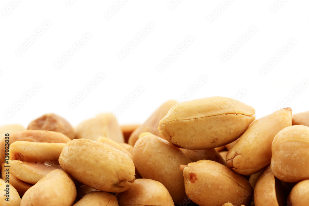 close up peeled peanuts on white background close up peeled peanuts on white background