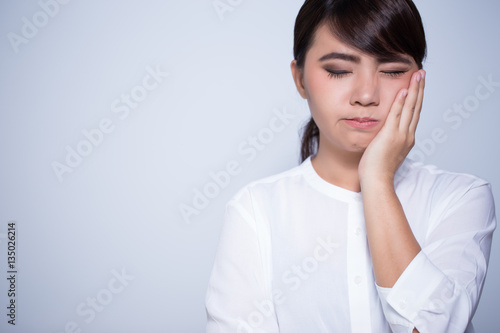 Woman has toothache coppy space