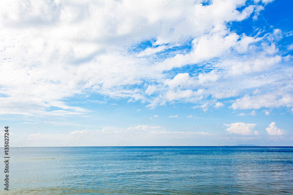 Blue sea and a moving reflection of sunlight