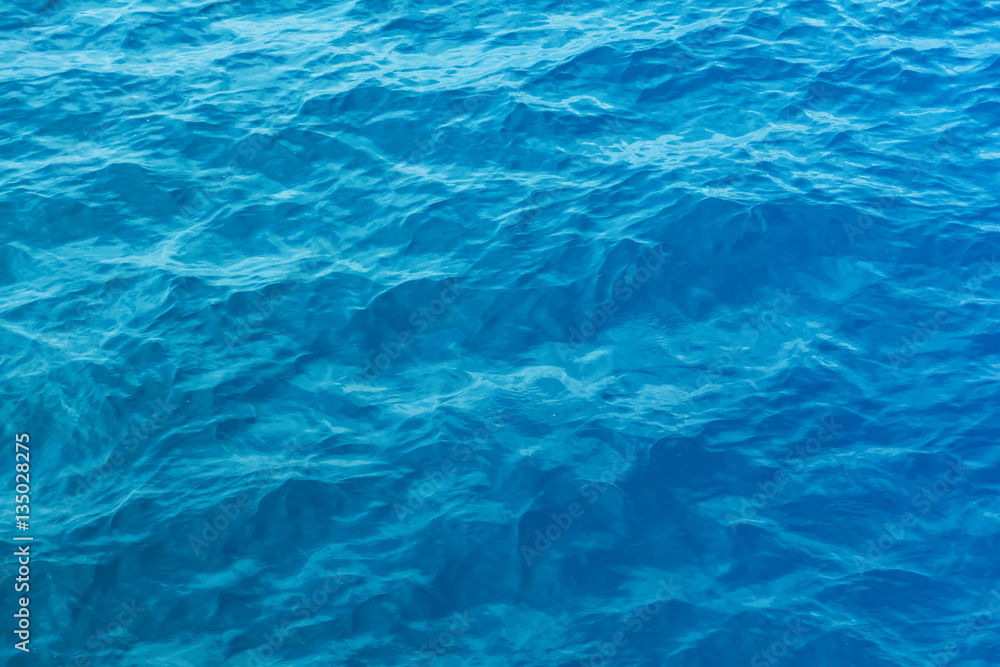 Blue sea and a moving reflection of sunlight Blue sea and a moving reflection of sunlight