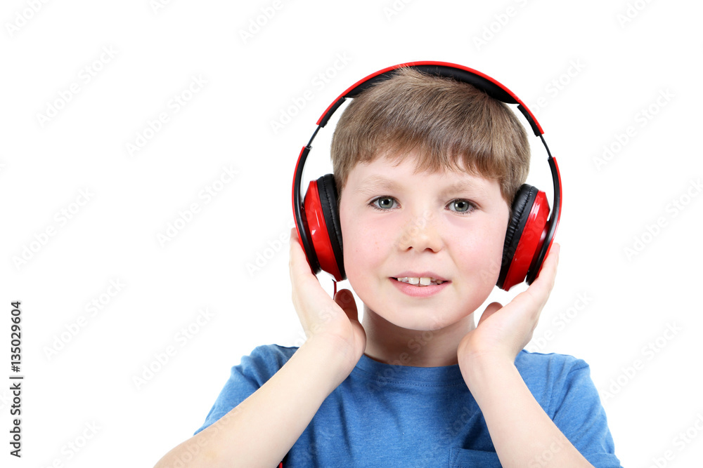Portrait of young boy with headphones on white background Portrait of young boy with headphones on white background