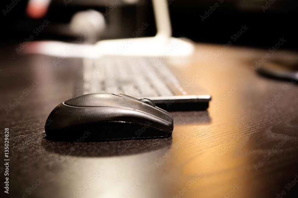computer mouse on a wooden table computer mouse on a wooden table