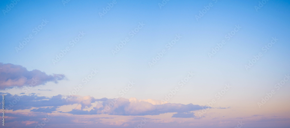 Sky background on sunset. Nature composition. Panoramic sunset sky background. Sunrise sky with lighted clouds. Beauty evening sunrise. 