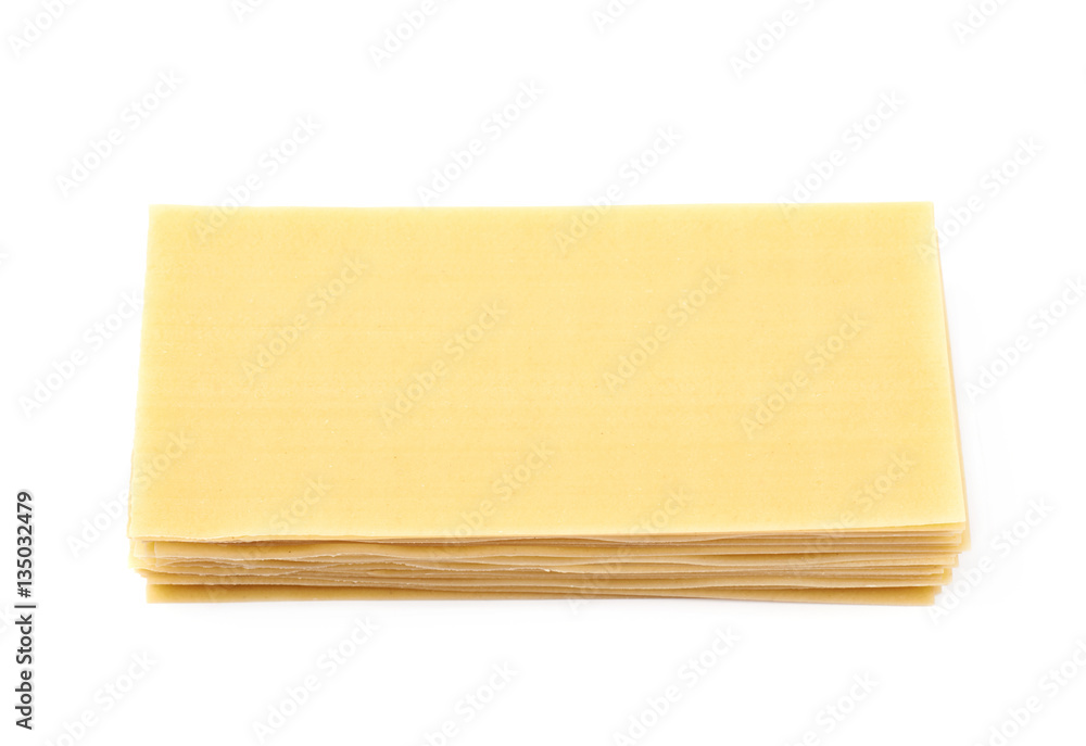 Pile of dried lasagna sheets isolated Pile of dried lasagna sheets isolated