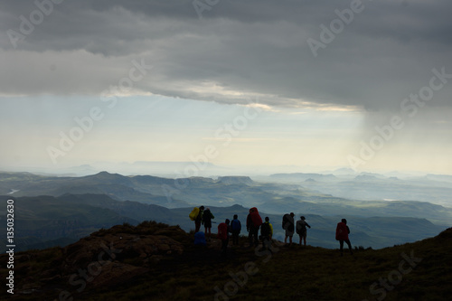Silhouette hikers on Drakensberg Mountains