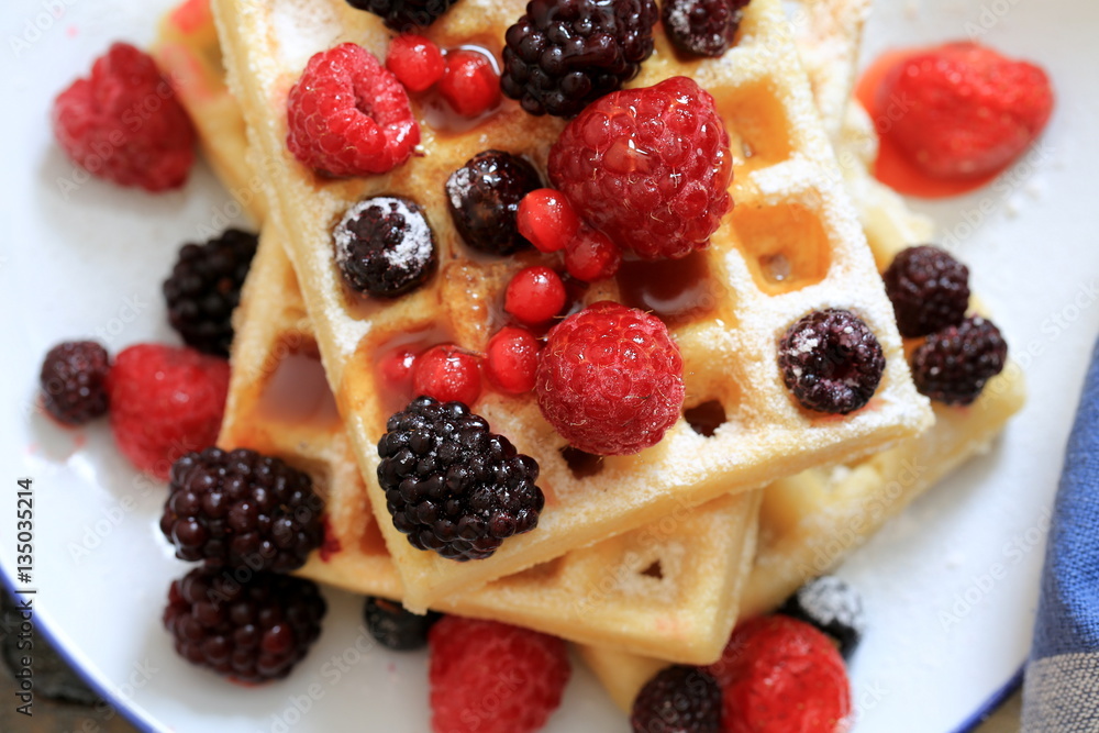 Waffles with fresh raspberries, blackberries and honey Waffles with fresh raspberries, blackberries and honey