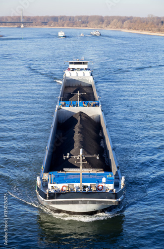 Fotótapéta inland general cargo vessel shipping on the river Rhine in Bonn/ Germany