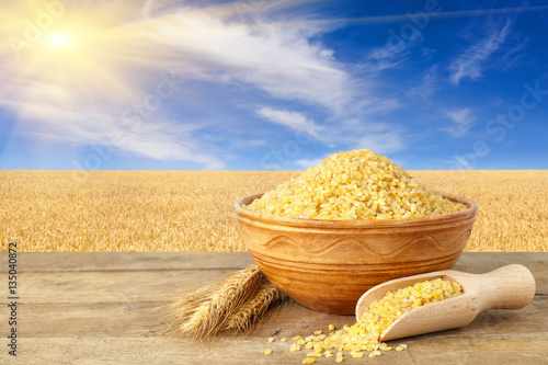 couscous in bowl on nature background