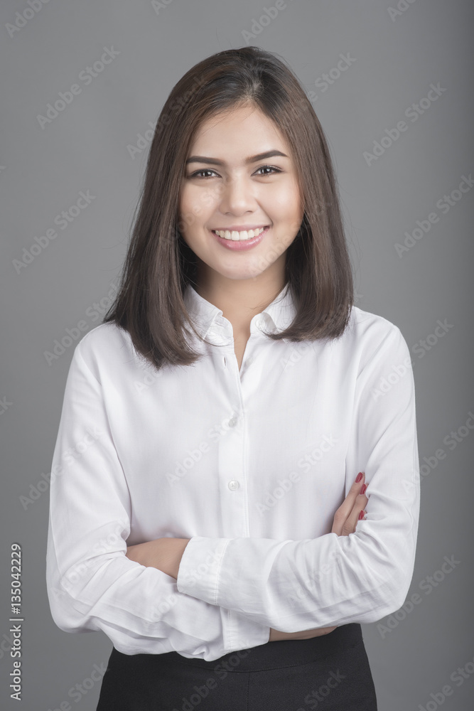 Beautiful Business Woman smiling on grey background Beautiful Business Woman smiling on grey background