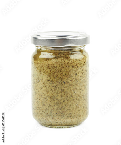 Glass jar of italian pesto isolated
