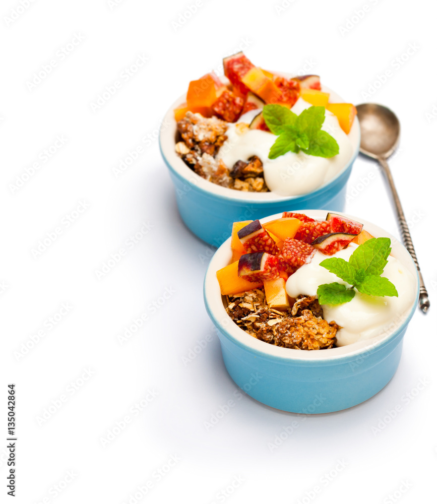 fruit crumble with oat flakes and persimmon and fig isolated on fruit crumble with oat flakes and persimmon and fig isolated on