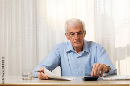 Older man doing his taxes