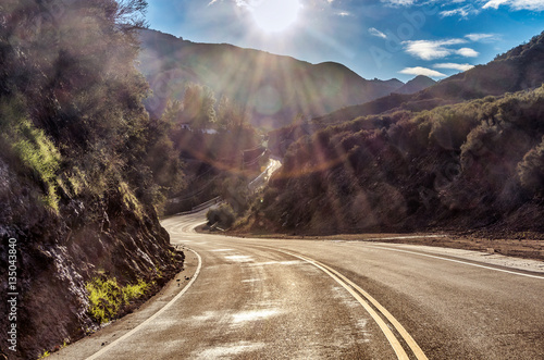 Sun shines on famous Mulholland Highway in Malibu, California photo