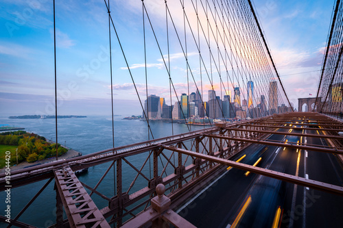 Traffic on the Brooklyn Bridge in New York. Blurred cars driving from Lower Manhattan. © VOJTa Herout
