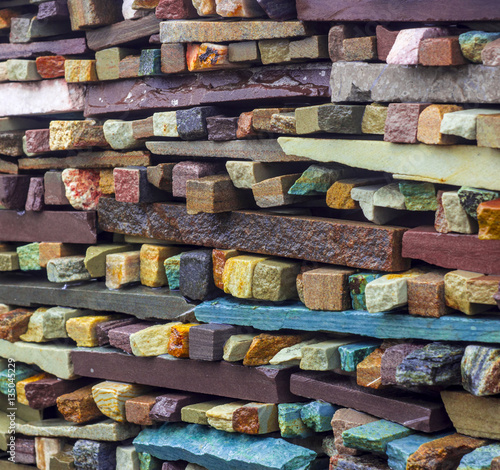 Wall of Indian sandstone with a beautiful structure, decorative building facing material © maykal