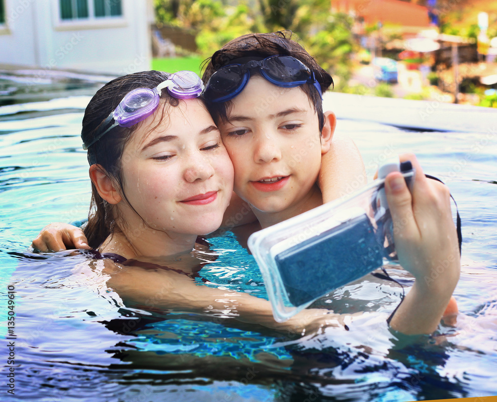 kids with underwater camera in swimming pool Stock Photo Adobe Stock