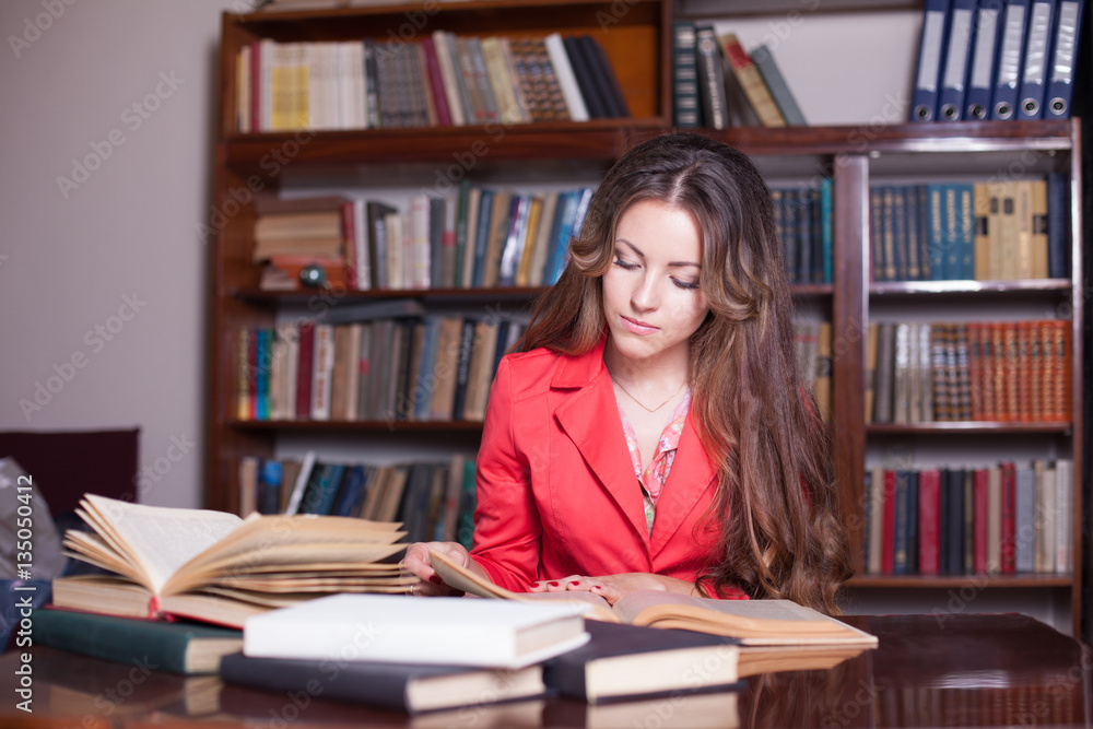 girl is preparing for the exam in the library girl is preparing for the exam in the library