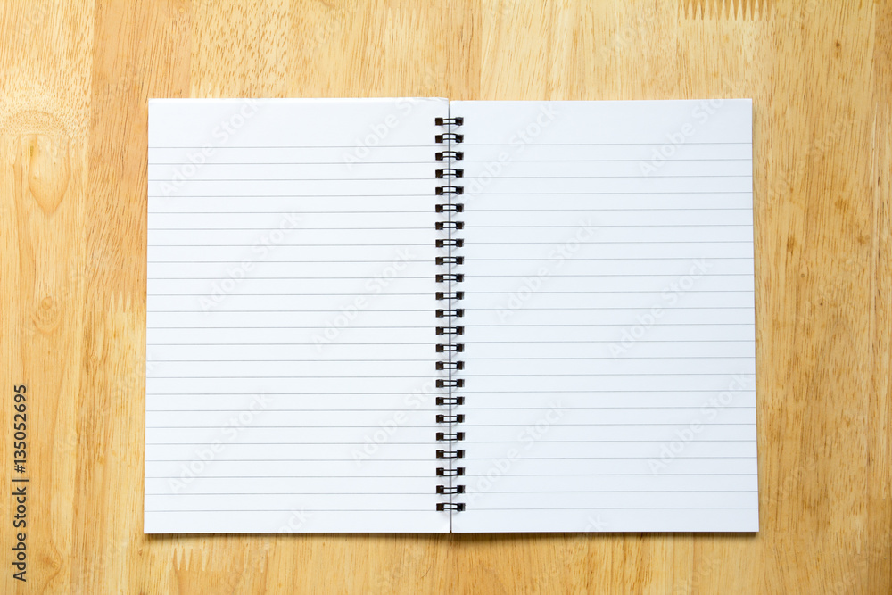 Blank open note book on wooden background Blank open note book on wooden background