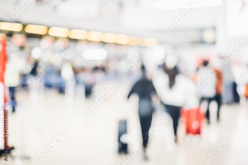 Blurred background,Traveler with baggage at Terminal Departure C