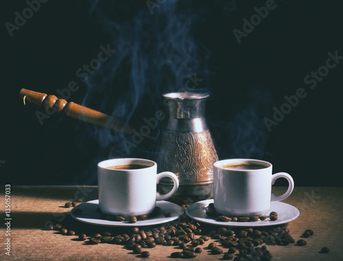 Hot coffee. Coffee grinder, turk and cup of coffee