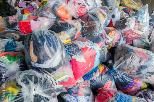 old second-hand clothes in plastic bags