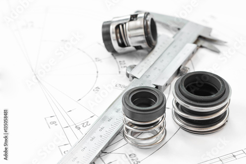Mechanical Seals for prevent liquid leak for the industry with drawings on table working.