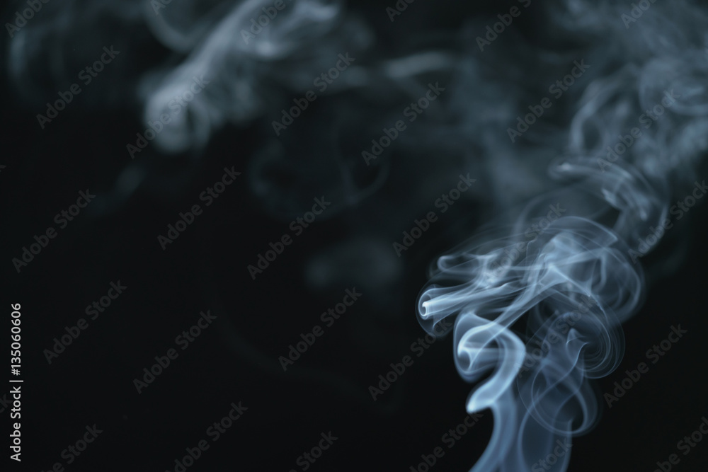 mystery dense blue smoke over dark background, abstract photo mystery dense blue smoke over dark background, abstract photo
