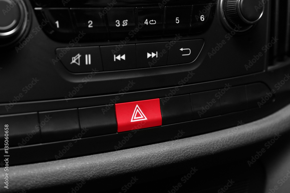 Fototapeta premium Emergency warning button on car console, closeup
