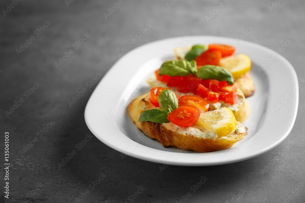 Delicious toast with tomatoes on plate Delicious toast with tomatoes on plate