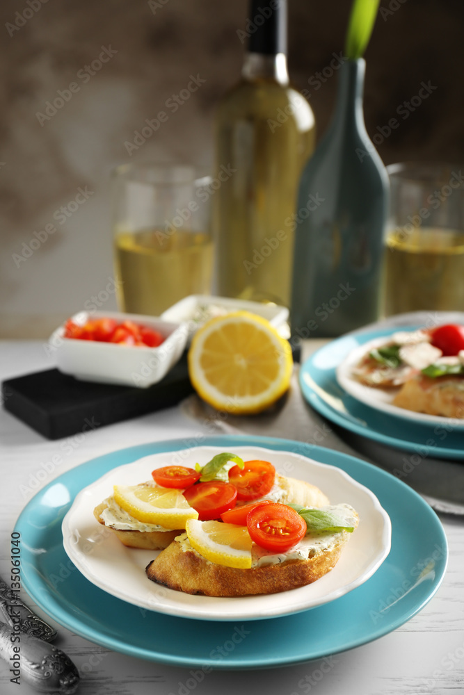 Plate with delicious bruschetta on table Plate with delicious bruschetta on table