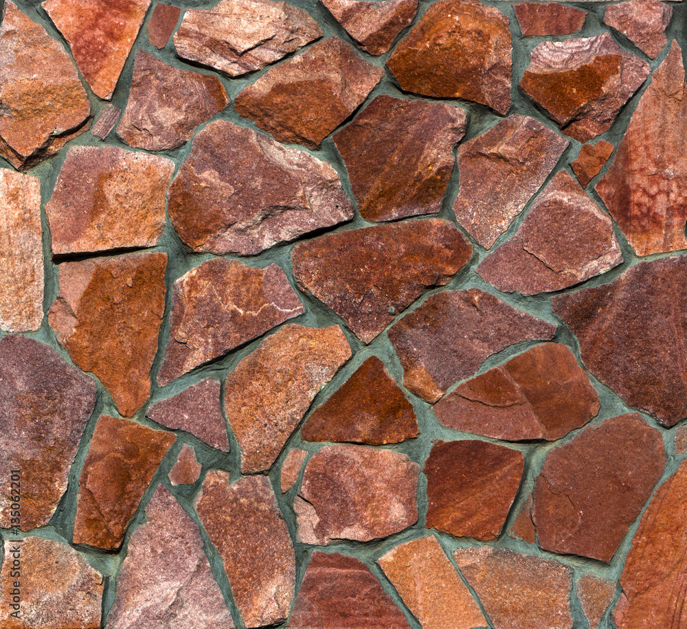 wall of gold and black shale, colorful wild natural stone. very beautiful wall of gold and black shale, colorful wild natural stone. very beautiful