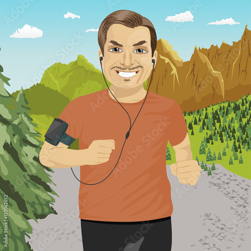 mature man jogging in mountains with smartphone armband listening to music playlist on mobile phone app