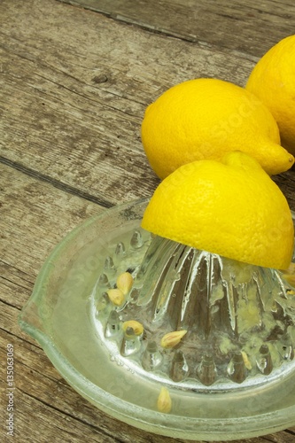 Lemon, citrus fruit. Fresh and juicy lemons on old wooden table. Tropical fruit full of vitamin C.