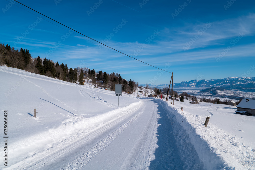 Swiss Winter - Road covered in snow Swiss Winter - Road covered in snow