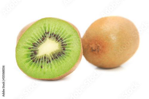 Cut of kiwi fruits isolated on white background.