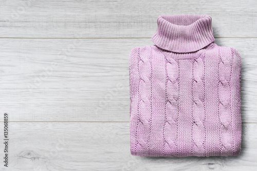 Fotografie Sweater on wooden background