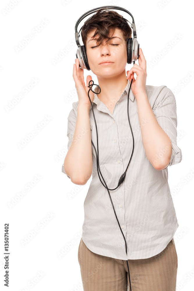 slim girl enjoying music with headphones isolated on white backg slim girl enjoying music with headphones isolated on white backg
