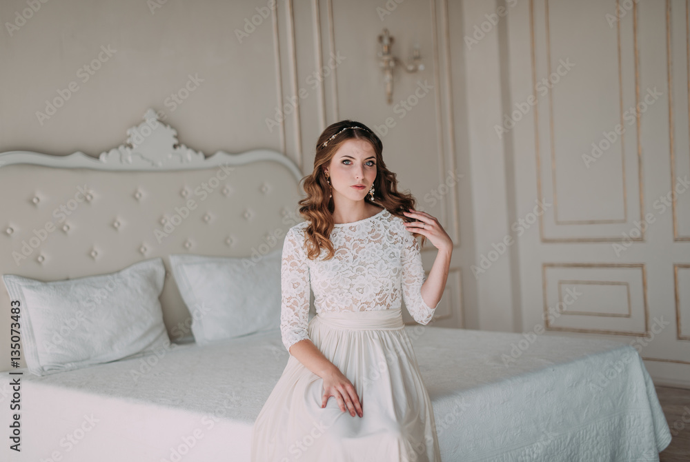 fashion studio photo of beautiful elegant bride with dark hair in luxurious wedding dress with headband fashion studio photo of beautiful elegant bride with dark hair in luxurious wedding dress with headband
