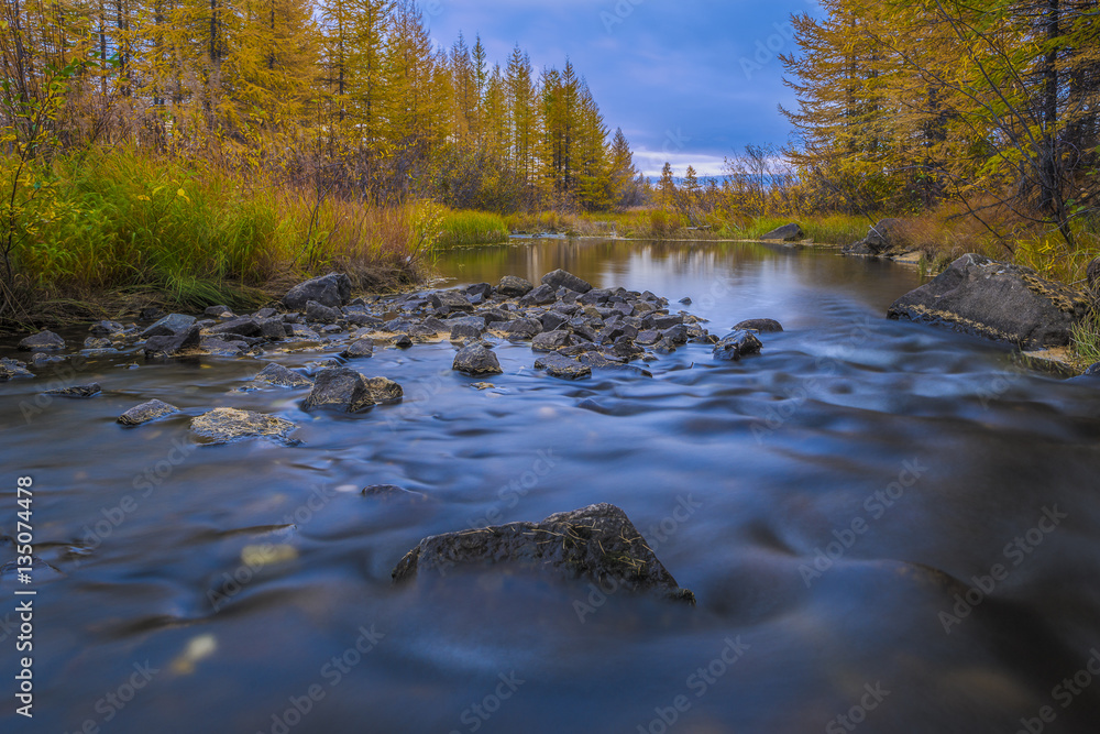 Fall autumn day landscape with river, forest, clouds on the blue sky and sun. Fall autumn day landscape with river, forest, clouds on the blue sky and sun.