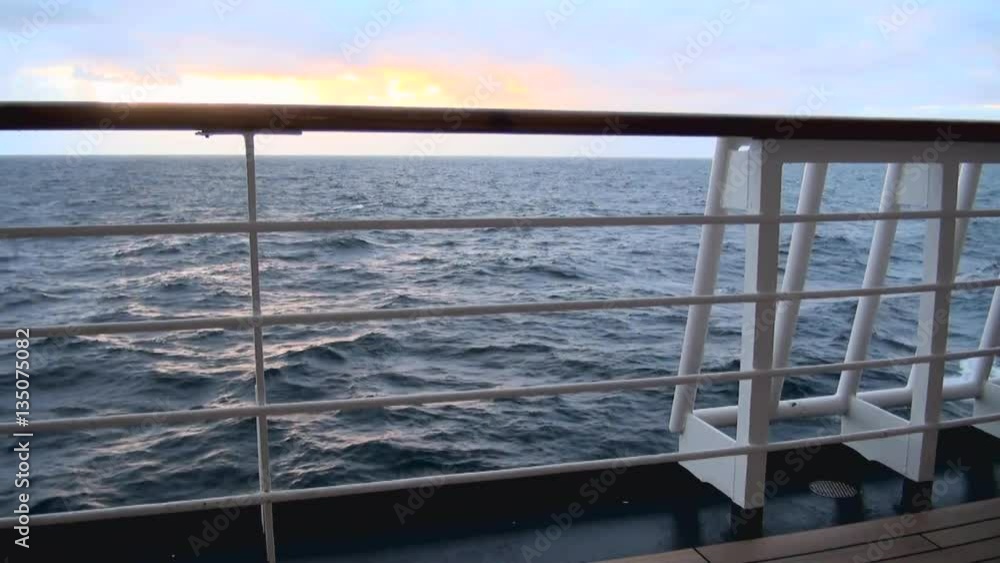 Sunset in Chilean Fjord - Deck railing of cruise ship in the Pacific Ocean - Travel Destination - South America - Cruising Antarctica Sunset in Chilean Fjord - Deck railing of cruise ship in the Pacific Ocean - Travel Destination - South America - Cruising Antarctica