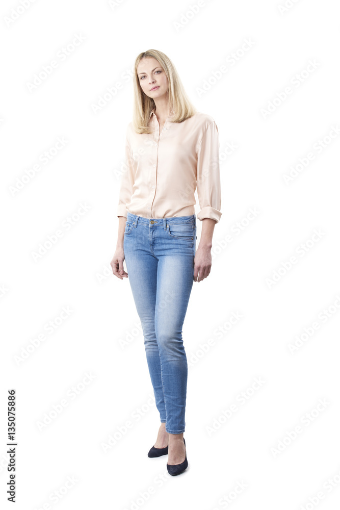 Confident mature female portrait. Full length shot of a smiling middle aged woman wearing casual clothing while standing at isolated white background. Confident mature female portrait. Full length shot of a smiling middle aged woman wearing casual clothing while standing at isolated white background.