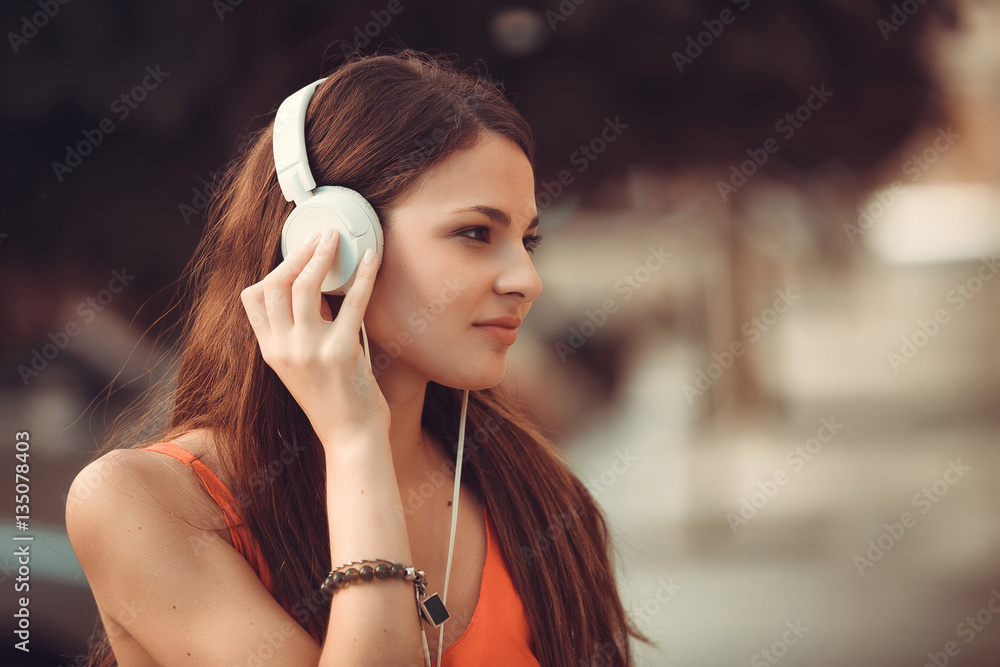 Fototapeta premium Portrait of Latin girl with headphones