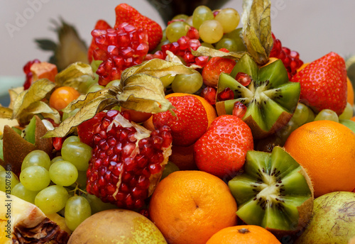 full glass vase of ripe tasty fruit