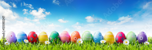 Easter Banner - Colorful Painted Eggs In Row On Grass  
