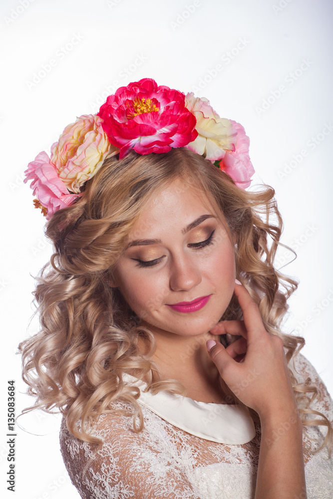 young and beautiful blonde with a wreath of flowers in her hair