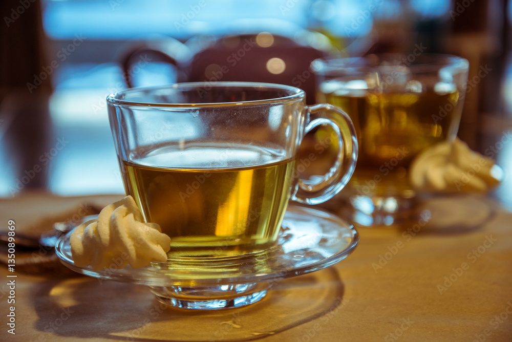 Hot tea cup on a frosty winter day window background Hot tea cup on a frosty winter day window background