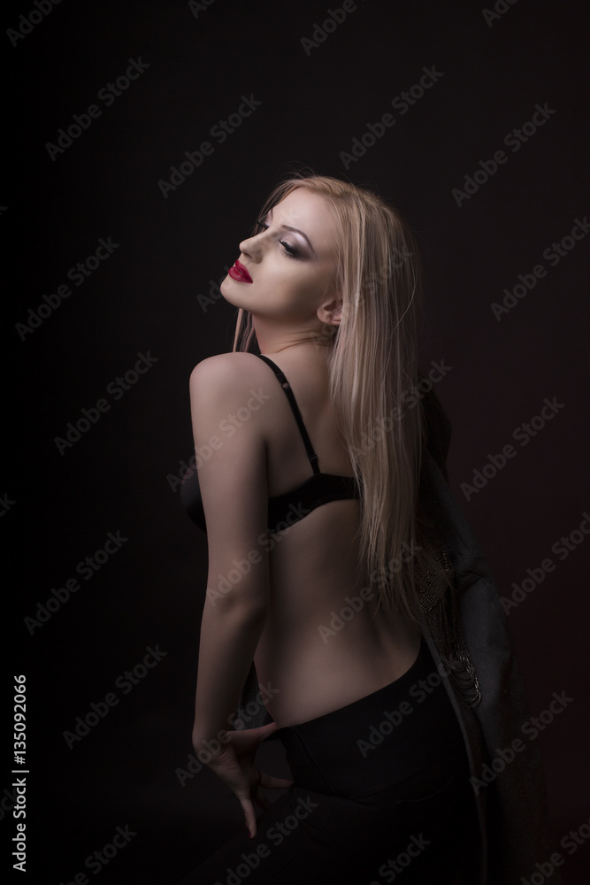 Fashionable young model with bright makeup and in black lingerie Fashionable young model with bright makeup and in black lingerie