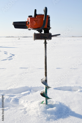 Obraz na plátne fishing auger for drilling holes on the frozen lake