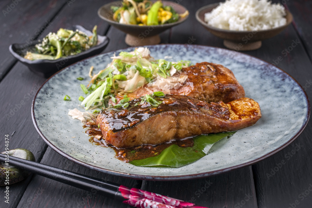 Traditional Japanese Salmon Teriyaki with Vegetable and Rice as close-up on a plate Traditional Japanese Salmon Teriyaki with Vegetable and Rice as close-up on a plate