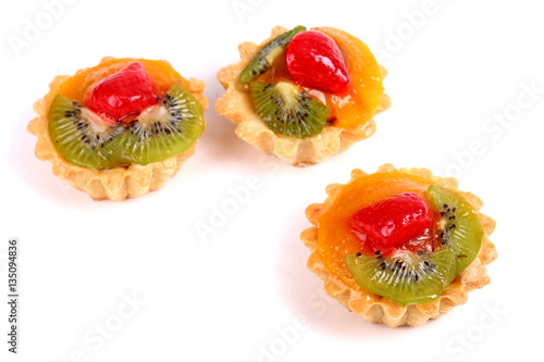 Sweet desserts with a kiwi, orange fruit and strawberry